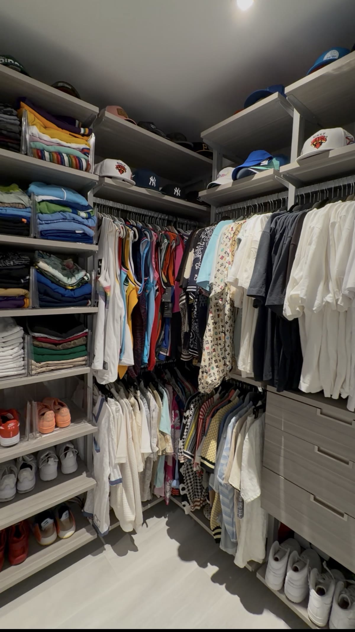 A finished walk-in closet styled by Juelle, every section organized into a working system.
